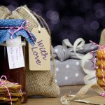 A selection of homemade treats, including cookies and jams, wrapped up and ready to give as Christmas presents.