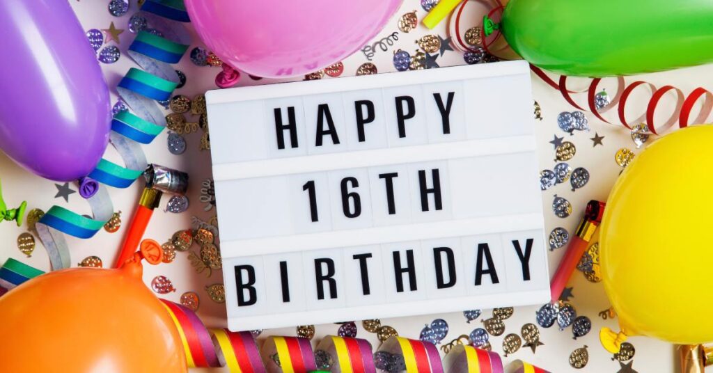 An LED light board with bold letters that say "happy 16th birthday." There are balloons and confetti surrounding the board.
